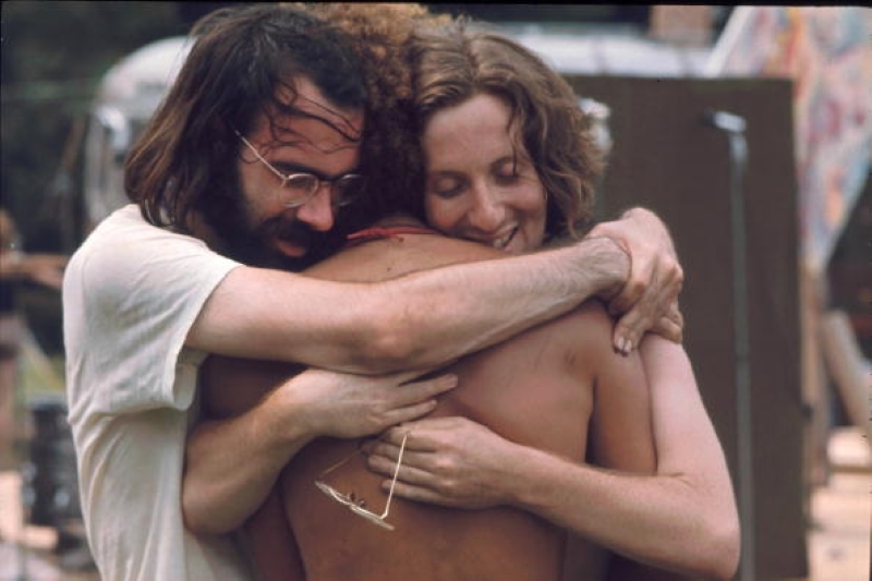 Festival-Goers Hugging at ‘The Greatest Peaceful Event’ | Getty Images Photo by Ralph Ackerman