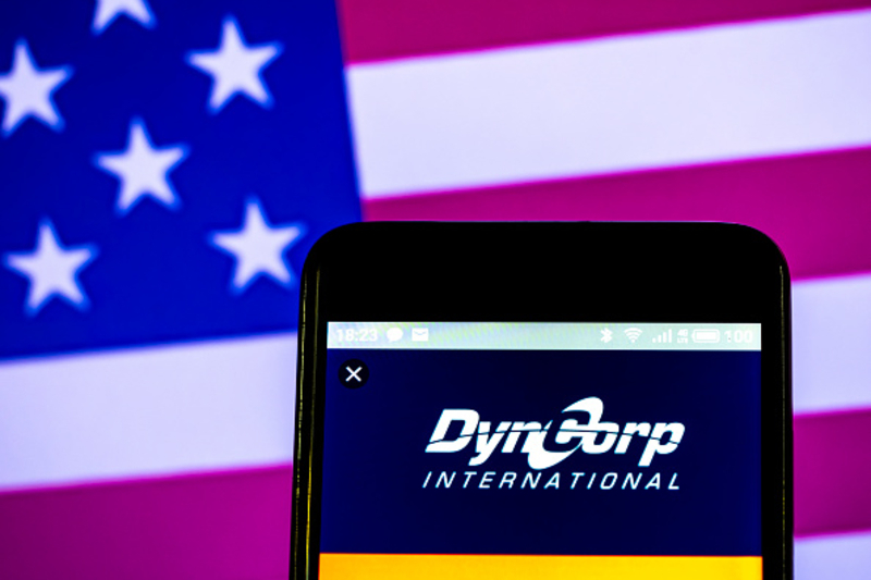 DynCorp International | Getty Images Photo Illustration by Igor Golovniov/SOPA Images
