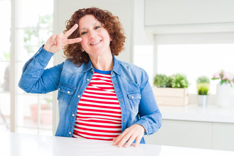 Making a Peace Sign | Shutterstock